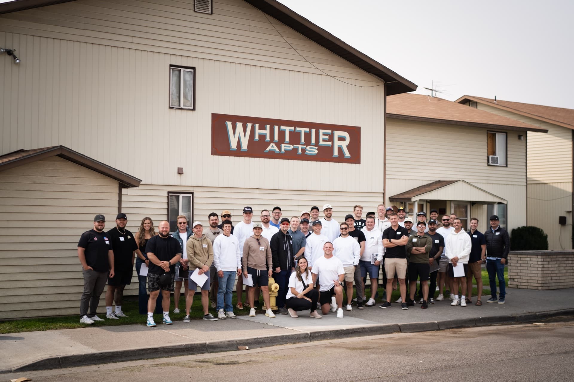 Property tour — the whole group at Whittier Apartments